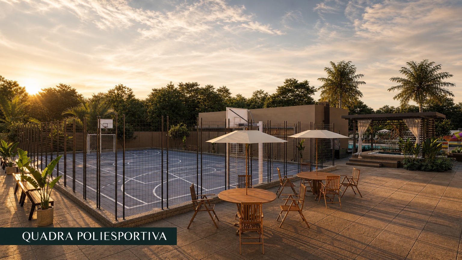 Quadra poliesportiva do condomínio ao pôr do sol, com mesas e guarda-sóis ao lado